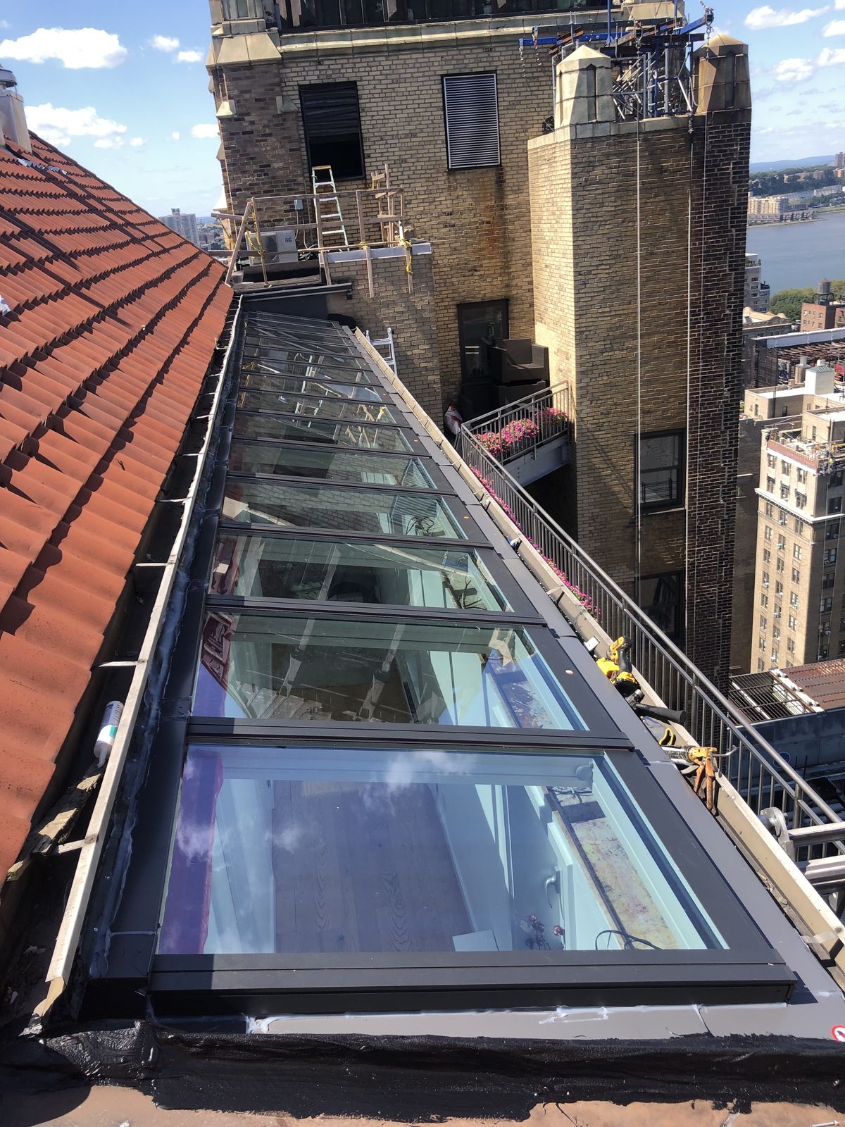 Sloped glazing run on a Manhattan penthouse