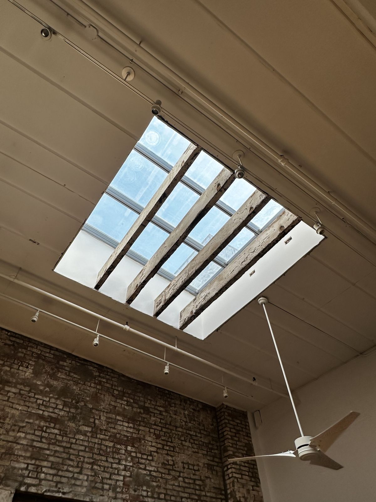 Gallery skylight with exposed beams — loft restoration